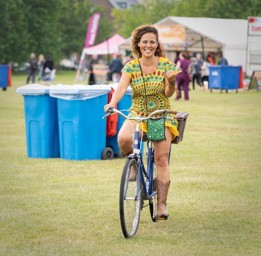 woman on bike colourful dress