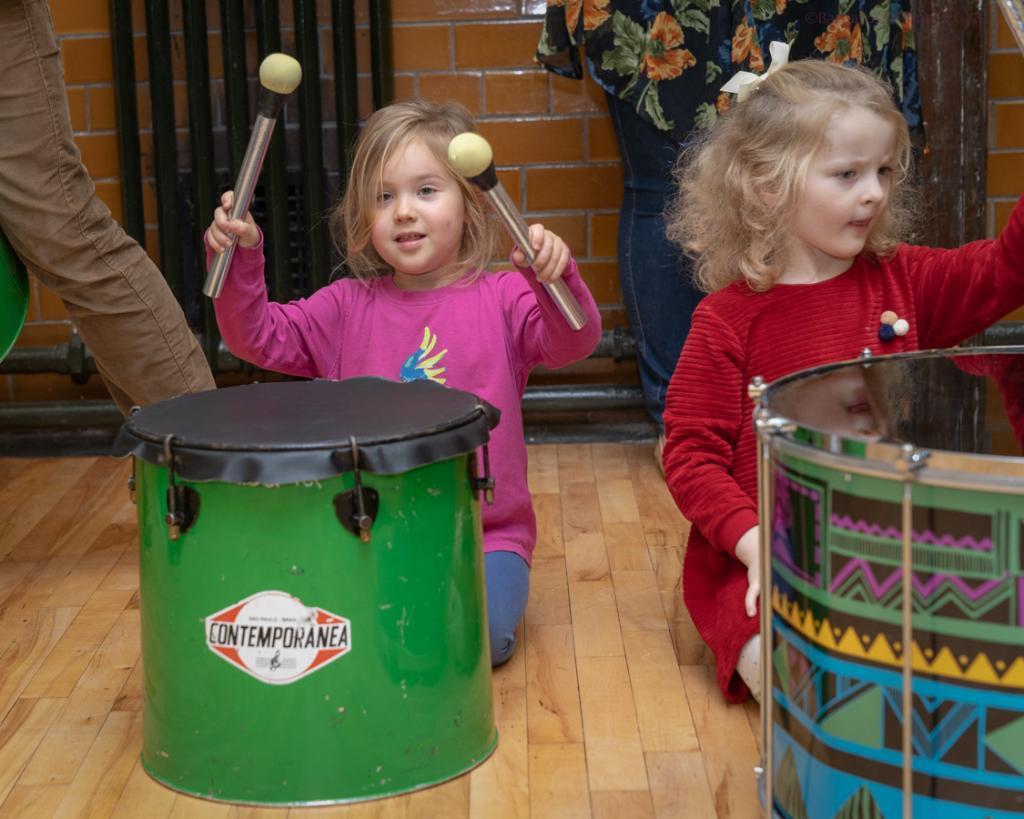 two small girls drumming