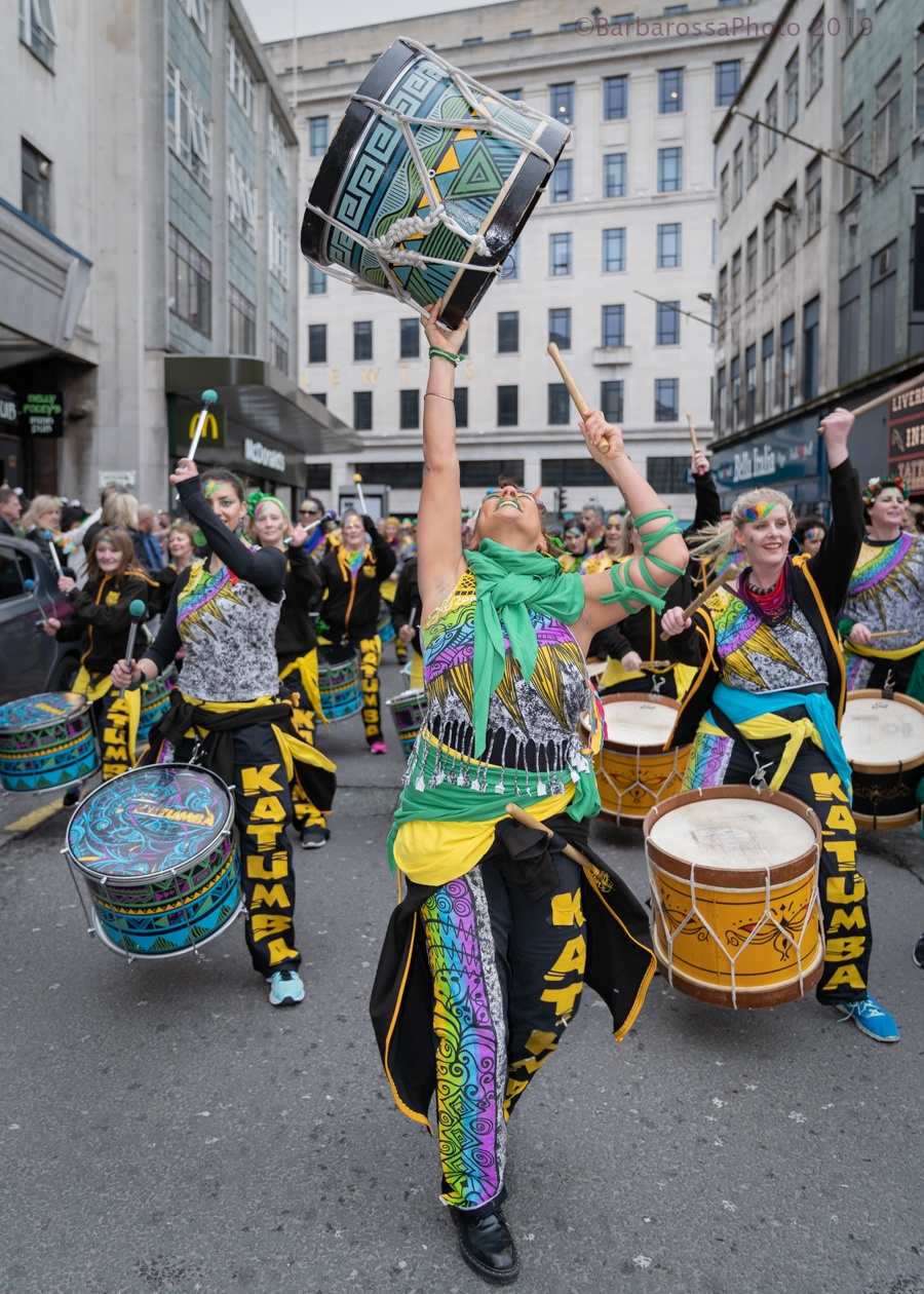 happy women lifting drum